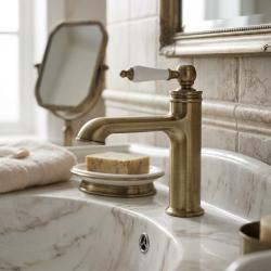brass-bathroom-faucet-with-white-handle